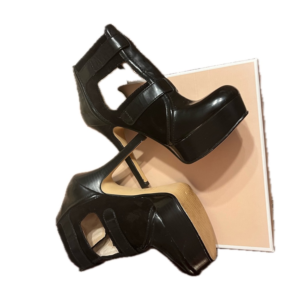 Michael Kors patent leather platform heels. Buckles and ankle height. 
Size 7M